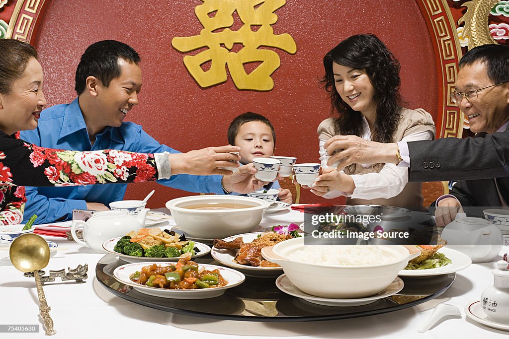 Family toasting at reunion dinner