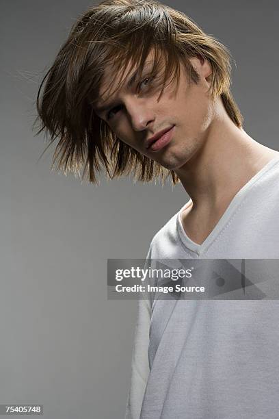 portrait of a young man - long hair wind stock pictures, royalty-free photos & images