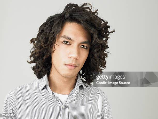 portrait of a young man - man with curly hair stock pictures, royalty-free photos & images