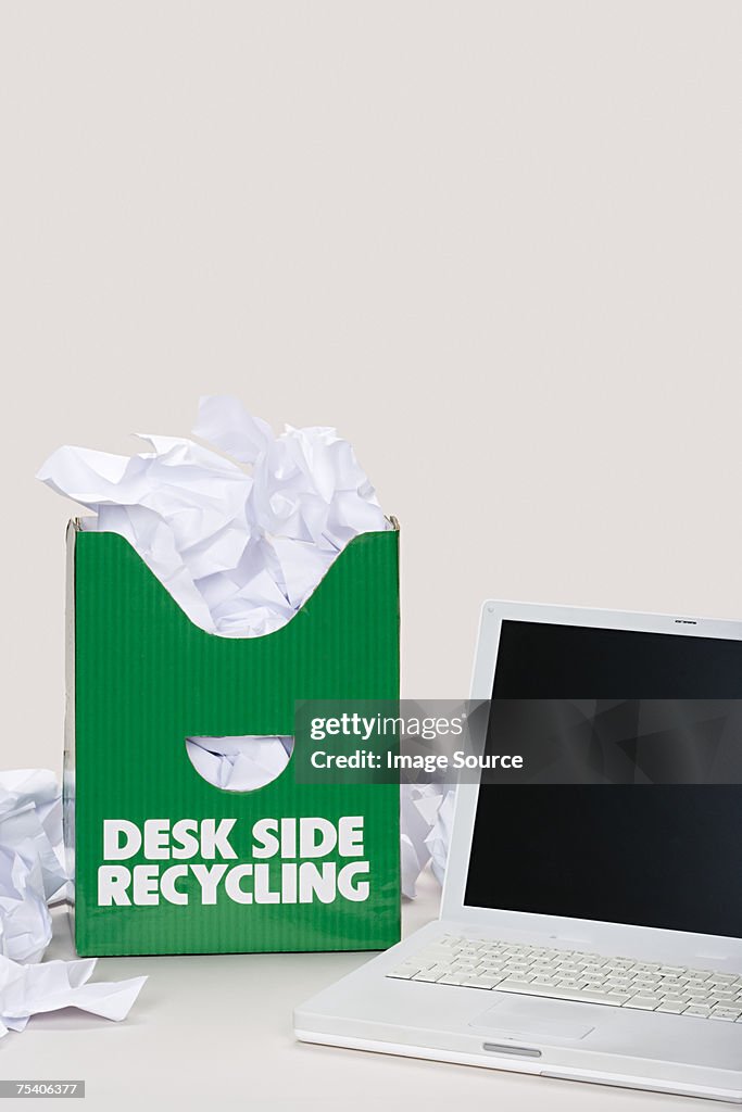 Laptop and recycling bin