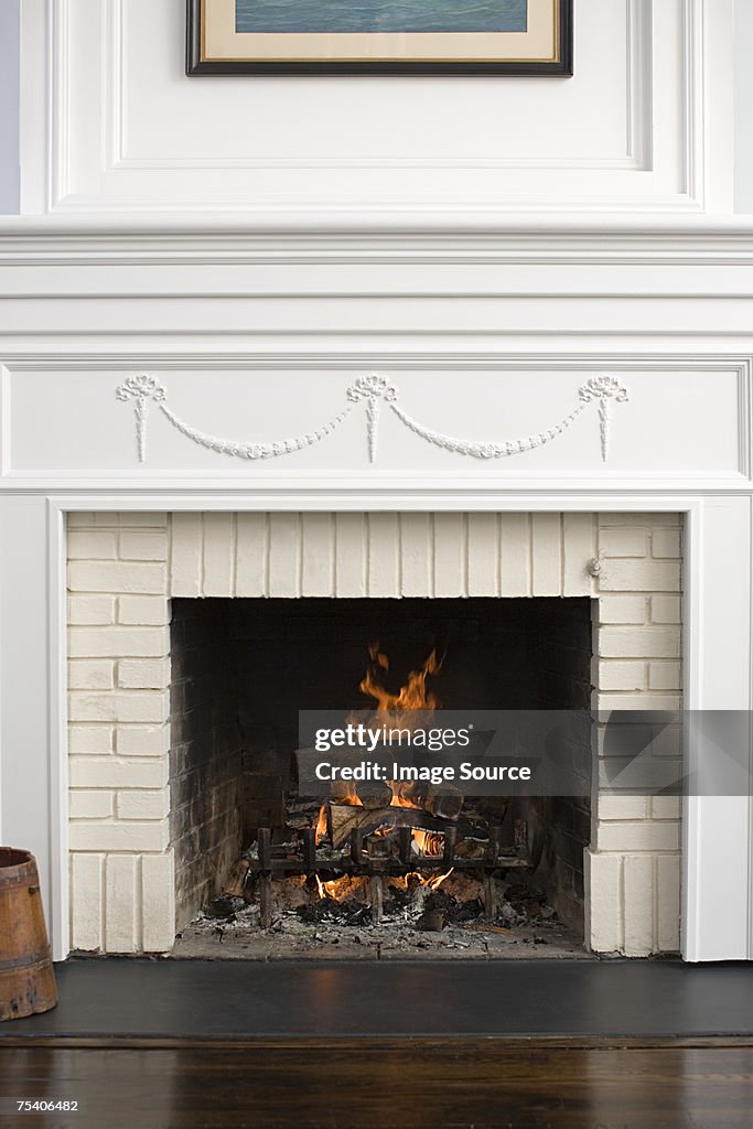 Fireplace with fire burning