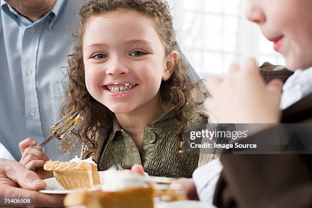 girl eating pie - man eating pie stock pictures, royalty-free photos & images