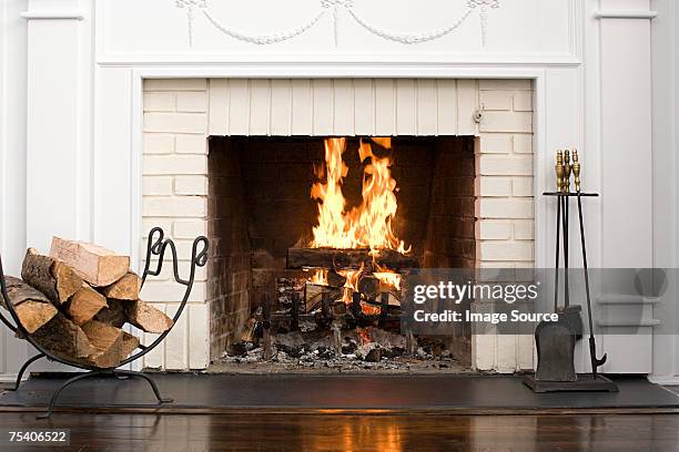 fireplace with fire burning - fire bildbanksfoton och bilder