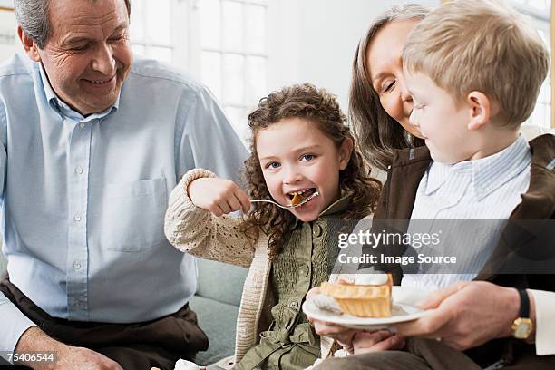 grandparents and grandchildren eating pie - man eating pie stock pictures, royalty-free photos & images