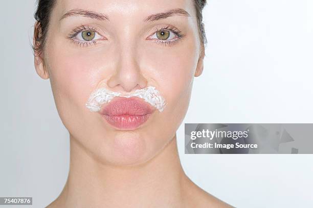 woman bleaching facial hair - lixívia imagens e fotografias de stock