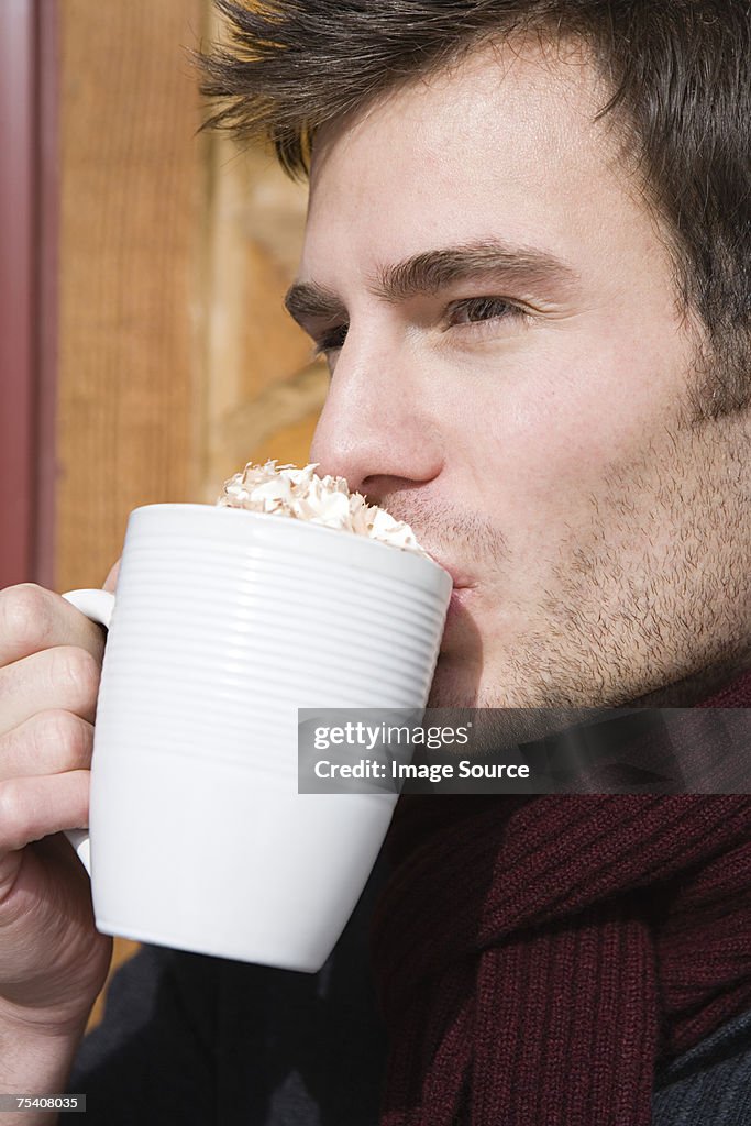 Young man drinking hot chocolate