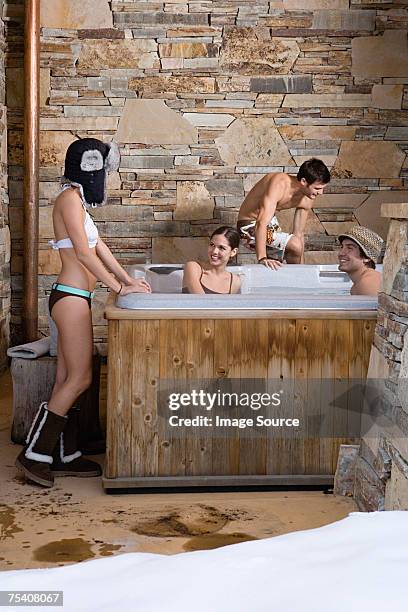 young people in a hot tub - apres ski stock pictures, royalty-free photos & images