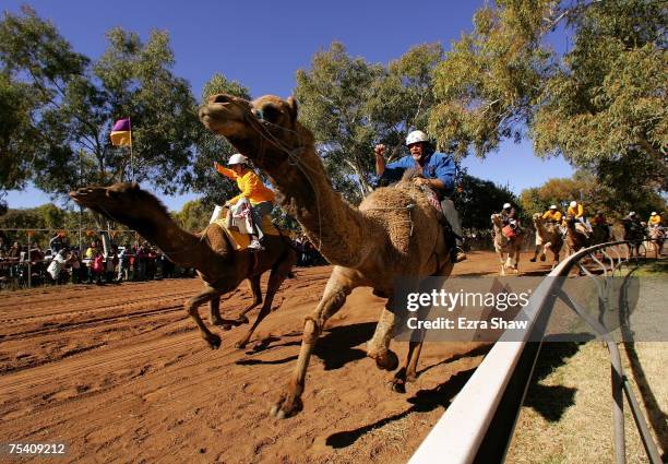 Shorty Smith of Tasmania and other jockeys compete in the Imparja Camel Cup during the 2007 Camel Cup at Blatherskite Park on July 14, 2007 in Alice...