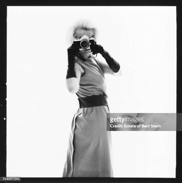 American actress Marilyn Monroe pointing a Nikon camera at photographer Bert Stern, Los Angeles, California, July 1962. The shoot took place six...