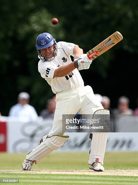 Chris Adams of Sussex drives a four off the bowling of Liam Plunkett during the Sussex v Durham LV County Championship match at Horsham cricket...