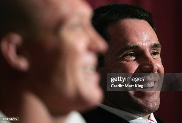 Roosters coach Brad Fittler laughs next to Craig Fitzgibbon at the post match press conference following the round 18 NRL match between the Sydney...