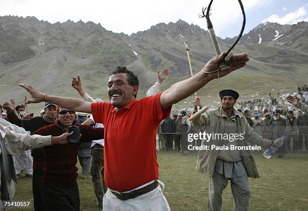 Chitral team players celebrate their win over Gilgit during the annual Shandur Polo Festival, July 8, 2007 on Shandur pass in Pakistan. The three day...