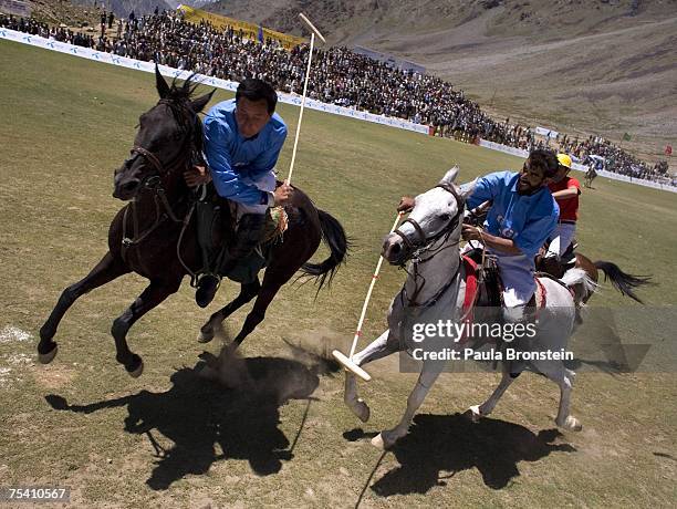 Polo team players from Gilgit charge down the field during the annual Shandur Polo Festival, July 8, 2007 on Shandur pass in Pakistan. The three day...