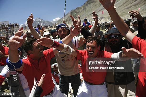 Chitral team players celebrate their win over Gilgit in the final game during the annual Shandur Polo Festival, July 9, 2007 on Shandur pass in...