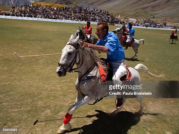 Polo team players Gilgit and Gilgit charge down the field during the annual Shandur Polo Festival, July 8, 2007 on Shandur pass in Pakistan. The...
