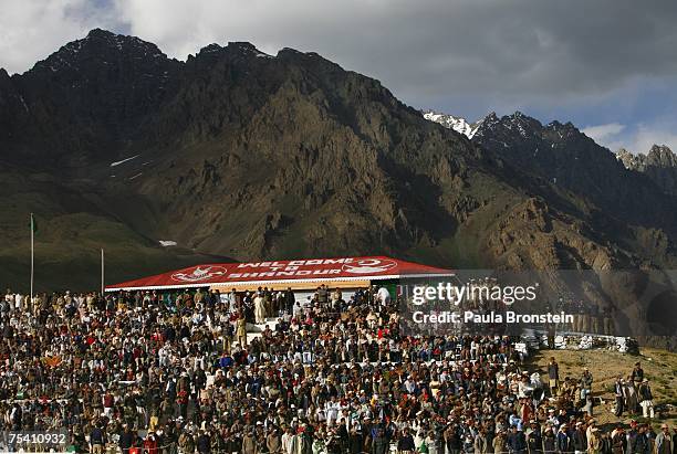 Spectators watch the action while keeping warm during the annual Shandur Polo Festival, July 8, 2007 in the Shandur Pass, Pakistan. The three day...