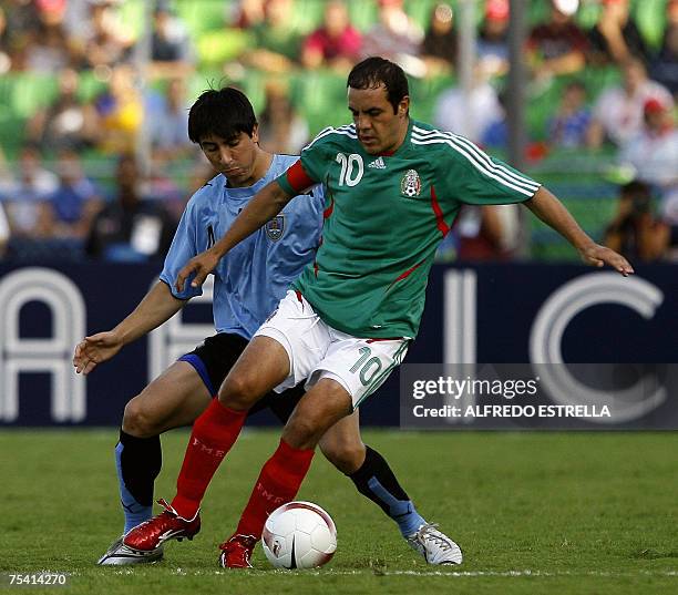Uruguay's player Jorge Fucile vies for the ball with Mexico's Cuauhtemoc Blanco during their match for the third place of the Copa America Venezuela...