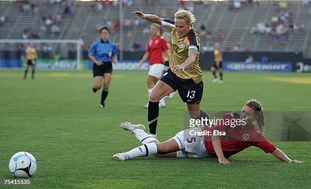 Kristine Lilly of the USA gets the ball past Siri Nordby of Norway in the second half during the Women's World Cup Send-Off Series on July 14, 2007...