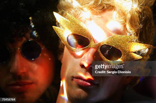 Party-goers pose during the 70's Disco International party held at the Equilibrium Hotel on July 14, 2007 in Sydney, Australia. The event is the...