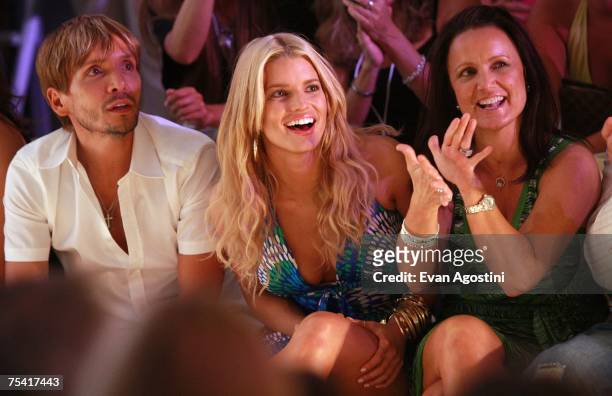 Stylist Ken Paves, Designer Jessica Simpson and Tina Simpson sit front row at the Jessica Simpson swimwear fashion show during "Mercedes Benz Fashion...