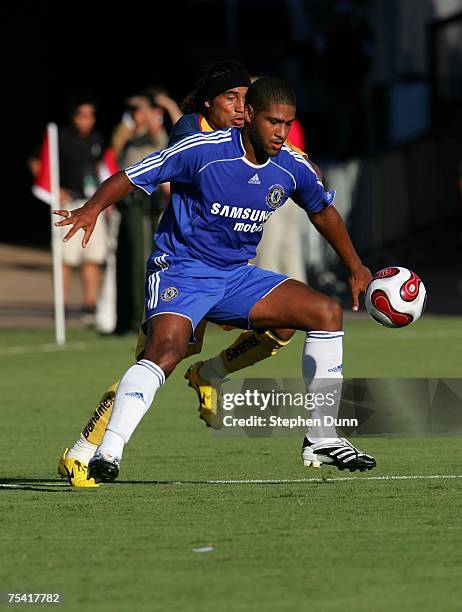 Glen Johnson of Chelsea FC keeps the ball away form Alvin Mendoza of Club America at Stanford Stadium July 14, 2007 in Palo Alto, California. Chelsea...