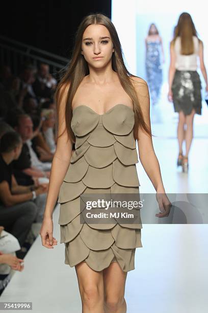 Model walks the runway displaying an outfit by Kaviar Gauche at the Karstadt New Generation Award fashion show during the Mercedes-Benz Fashion Week...