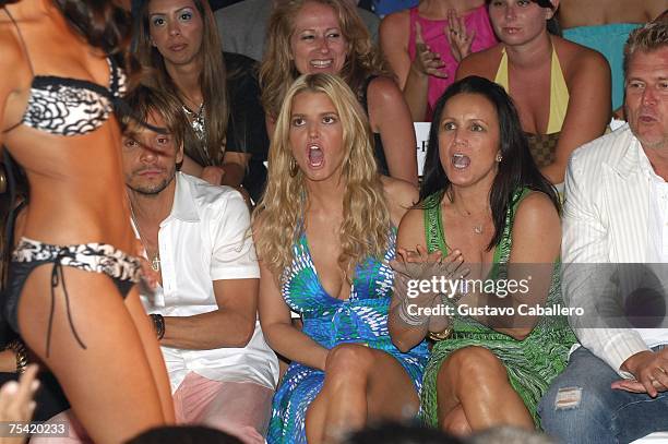 Stylist Ken Paves, Designer Jessica Simpson, Tina Simpson and Joe Simpson sit front row at the Jessica Simpson swimwear fashion show during "Mercedes...