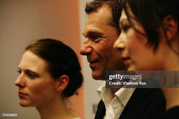 Winning designers Alexandra Fischer-Roehler and Johanna Kuehl of Kaviar Gauche pose with Karstadt CEO Peter Wolf after the Karstadt New Generation...