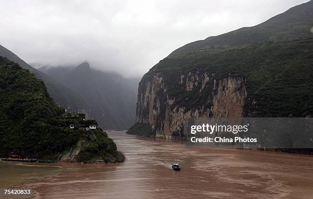 Boat sails at the Kuimen Gate of Qutang Gorge, one of the Three Gorges along the Yangtze River on July 13, 2007 in Fengjie County of Chongqing...