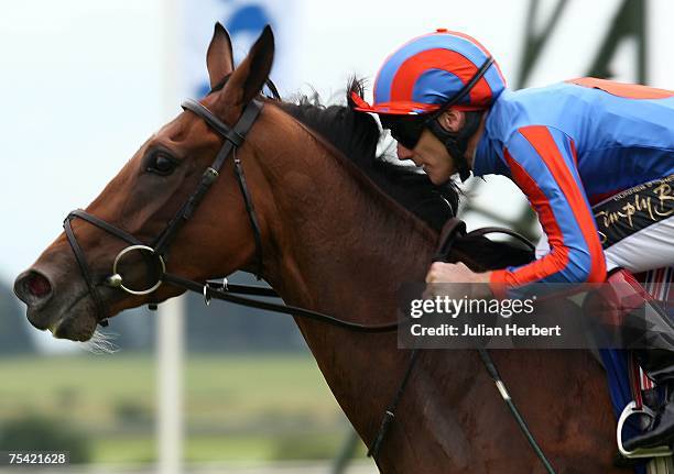 Johnny Murtagh and Peeping Fawn return after landing The Darley Irish Oaks Race run at The Curragh Racecourse on July 15 in The Curragh,Ireland.