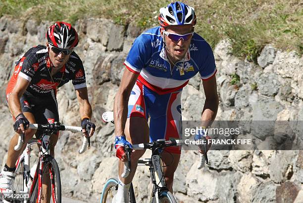 France?s Christophe Moreau rides in front of Spain?s Alejandro Valverde during the eighth stage of the 94th Tour de France cycling race between...