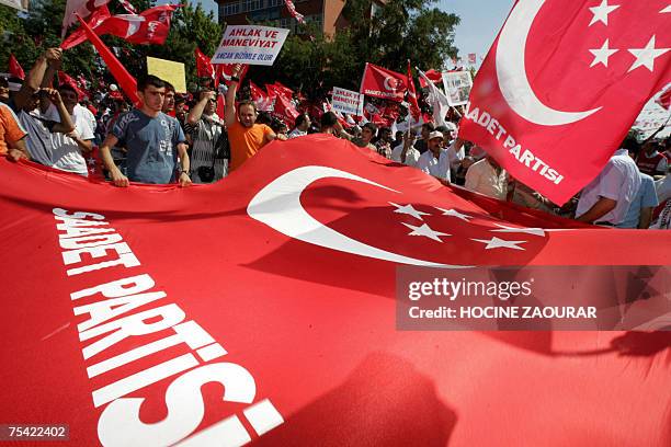 Supporters of Necmettin Erbakan, leader of Saadet party , attend an election rally in Istanbul 15 July 2007. Turkey holds parliamentary elections on...