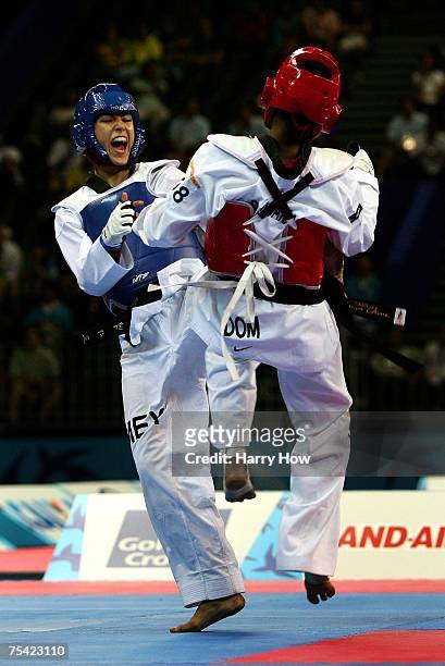 Alejandra Gaal of Mexico kicks Jahaira Peguero of the Dominican Republic during the Taekwondo women's 49kg final at the 2007 XV Pan American Games at...