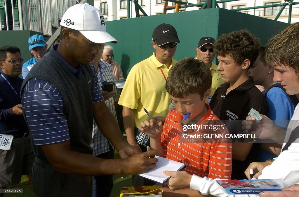 Tiger Woods from the USA signs autograph...
