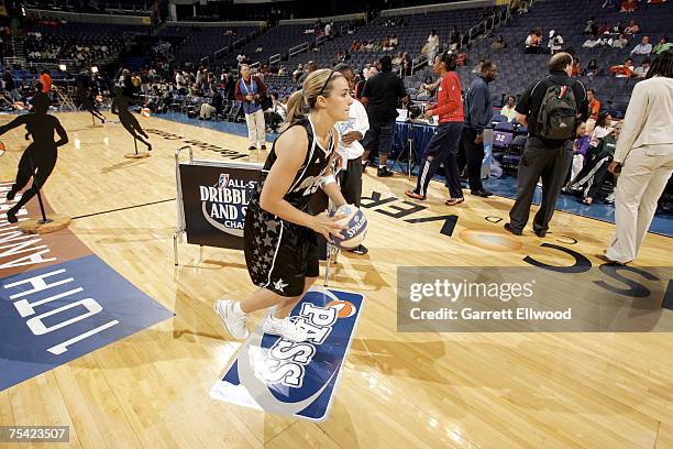 Becky Hammon of the San Antonio Silver Stars passes during the Dribble, Dish & Swish Competition prior to the 2007 WNBA All-Star Game presented by...