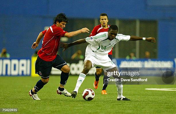 Gary Medel of Team Chile battles for the ball with Chukwuma Akabueze of Team Nigeria during their FIFA U-20 World Cup Canada 2007 quarter-final game...