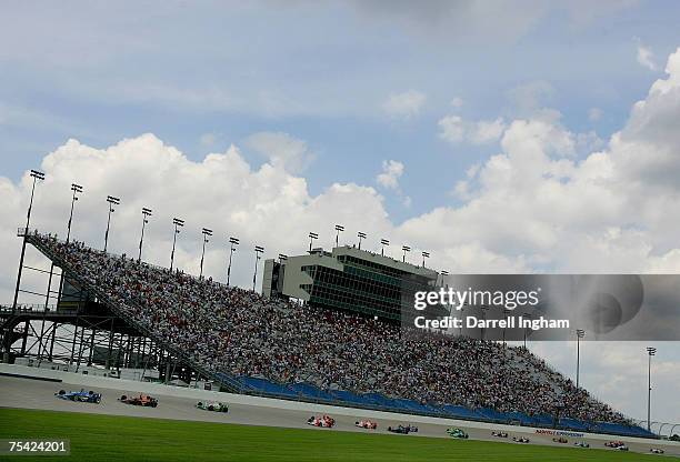 Scott Dixon, driver of the Target Chip Ganassi Racing Dallara Honda leads the field at the start of the IRL IndyCar Series Firestone Indy 200 July...