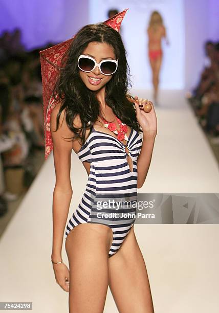Model walks down the runway at the Jessica Simpson swimwear fashion show during "Mercedes Benz Fashion Week: Miami Swim" in the Cabana Grande tent at...