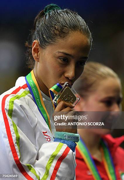 Rio de Janeiro, BRAZIL: Mexican Taekwon-Do fighter Iridia Salazar kisses her gold medal after winning the under 57Kg category, 15 July 2007, during...