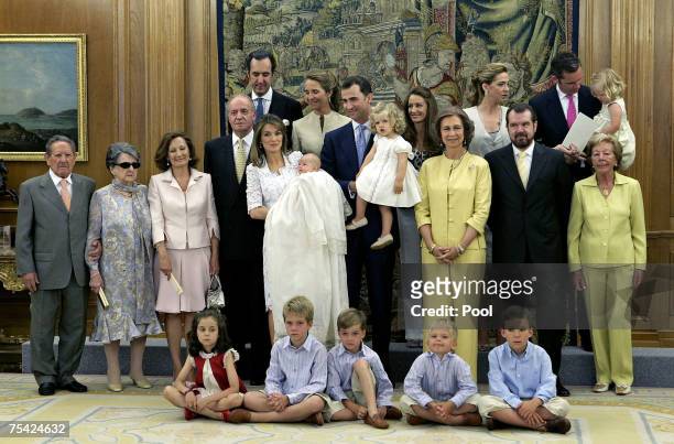 Princess Letizia of Spain holds her daughter Princess Sofia with members of the Spanish Royal family during the baptism of Princess Sofia on July 15,...