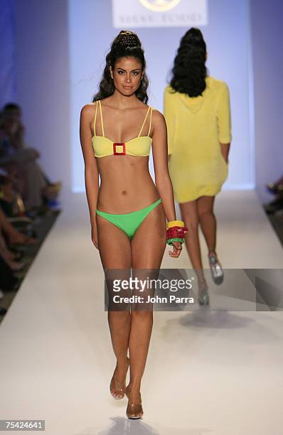 Model walks down the runway at the Shay Todd swimwear fashion show during "Mercedes Benz Fashion Week: Miami Swim" in the Cabana Grande tent at the...