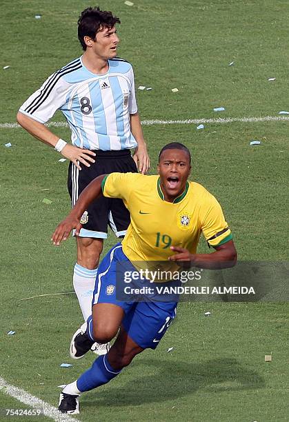 Brazil's Julio Baptista celebrates his goal next to Argentina's Javier Zanetti, during their Copa America Venezuela-2007 final match 15 July, 2007 at...