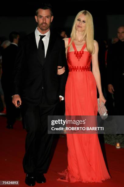 Rupert Everett and former model Claudia Schiffer arrive at dinner at Palazzo Reale at the end of the "Thank you Gianni with Love" ballet show in...