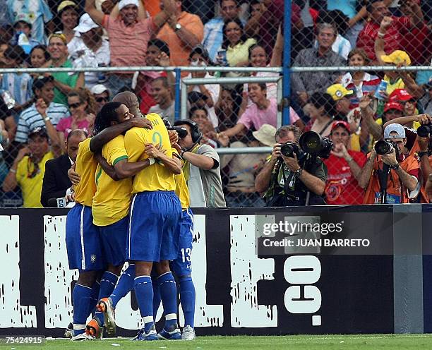 Brazilian forward Robinho , defender Maicon and forward Vagner Love celebrate Argentina?s own goal during their Copa America 2007 final match at the...