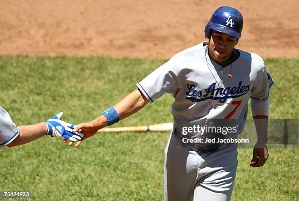 James Loney of the Los Angeles Dodgers celebrates after scoring on a triple hit by Jeff Kent against the San Francisco Giants in the fourth inning...