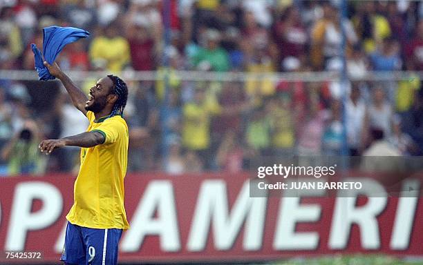 Brazilian forward Vagner Love celebrates the victory of his team against Argentina at the end of the Copa America Venezuela-2007 final match at the...