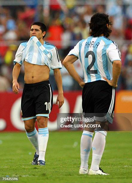 Argentina's football players Juan Roman Riquelme and Roberto Ayala show their dejection at the end of Copa America Venezuela-2007 final match against...