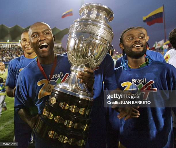Brazilian defender Maicon and forward Vagner Love celebrate at the end of the Copa America 2007 final match against Argentina at the Pachencho Romero...