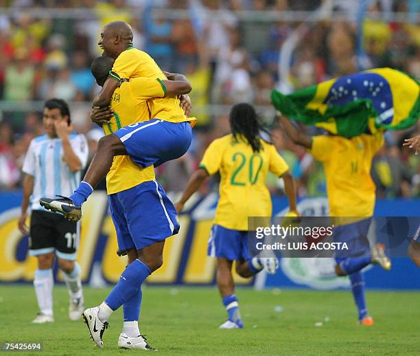 Brazilian players Julio Baptista and Gilberto celebrate at the end of the final match of the Copa America 2007 against Argentina at Pachencho Romero...