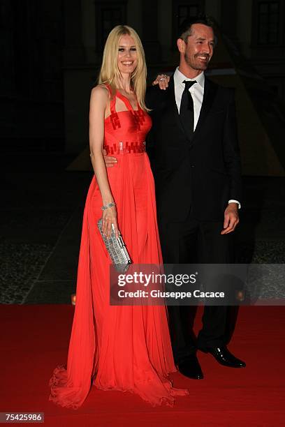 Rupert Everett and Claudia Schiffer arrive at the dinner at Palazzo Reale, after the ballet "Thanks Gianni with Love" to commemorate the tenth...